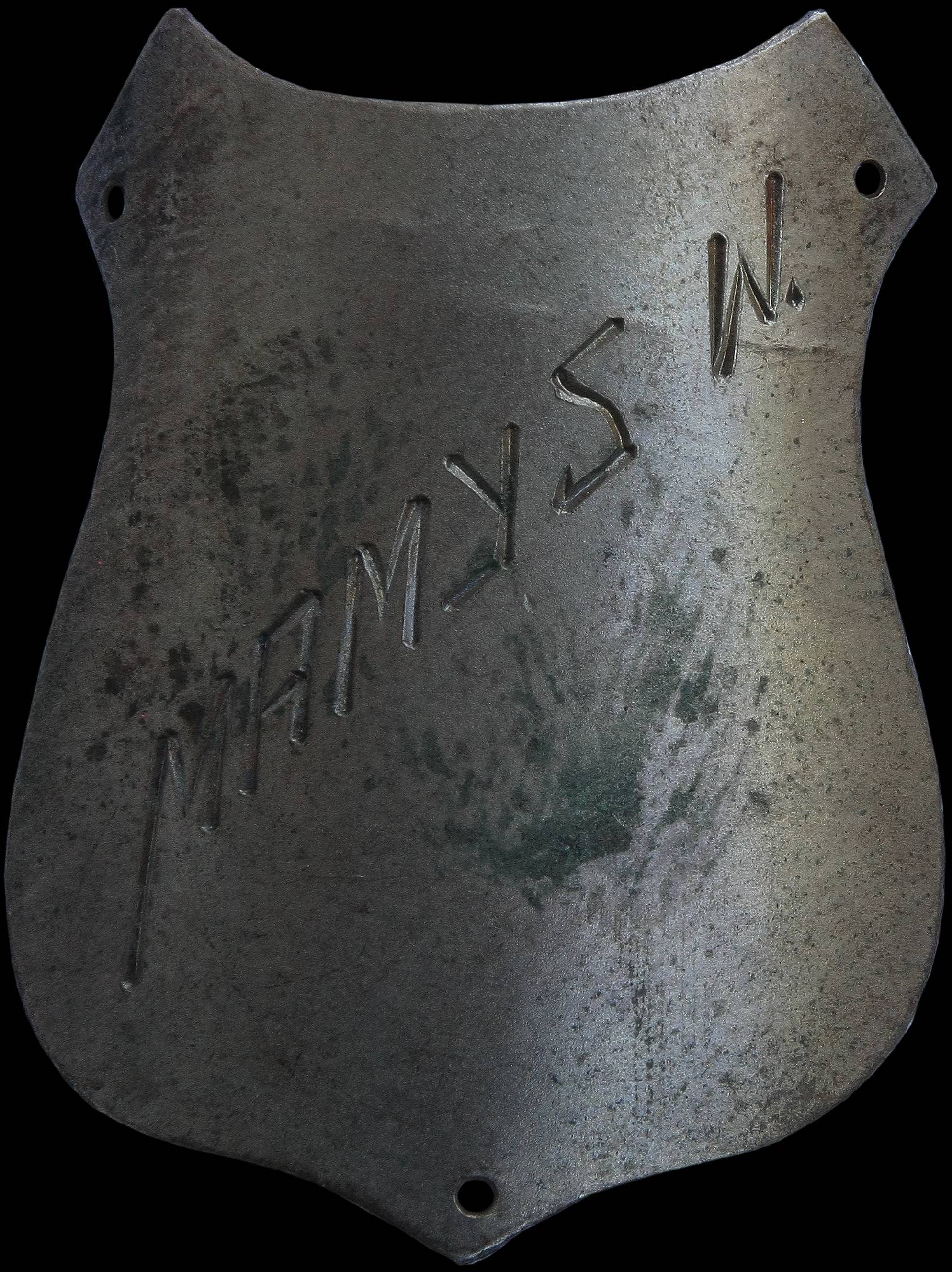 Metalowa tarcza z napisem „w niani”.